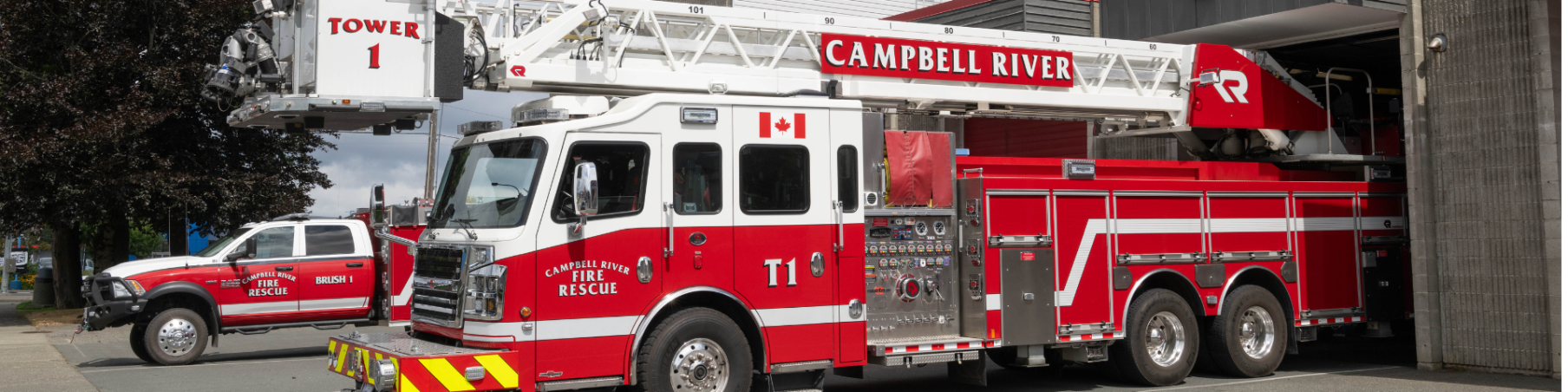 Fire truck and smaller pick up truck together in front of Firehall #1