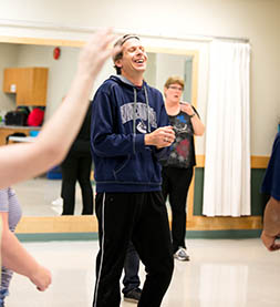 Please note: photo is of specialized recreation program participant Dave Marsters enjoying Zumba before COVID-19.